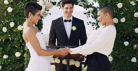 Image showing Love, holding hands and gay with lesbian couple at wedding for celebration, lgbtq and pride. Smile, spring and happiness with women at marriage event for partner commitment, romance and freedom