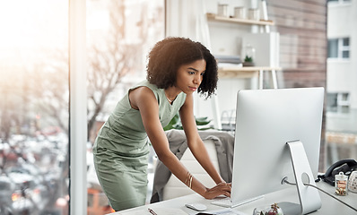 Image showing Computer, schedule and woman planner typing and working by her desk or table in a corporate startup company. African, business and professional female employee or personal assistant planning project