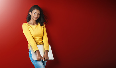 Image showing Woman, happy student and portrait with a laptop for university and school work with mockup. Isolated, red background and studio with a young Indian female person with smile and computer for college