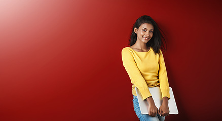 Image showing Woman, student and smile portrait with a laptop for university and school work with mockup. Isolated, red background and education work of a young Indian female person with computer for college