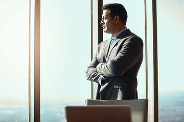 Image showing Business man, office window and thinking of ideas, plan or vision in city building. Professional male executive with arms crossed for motivation or inspiration for corporate career and development