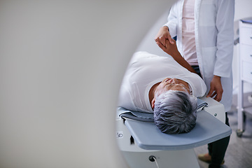 Image showing Doctor, mri and woman holding hands of patient in hospital before scanning in machine. Ct scan, cancer and medical professional with senior person in radiology test for healthcare in clinic.