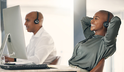 Image showing Relax, call center and a happy woman with a headset at computer with a smile for target achievement. Black person crm support agent at pc to finish task for telemarketing, sales or help desk solution