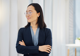 Image showing Office window, arms crossed and confident Asian woman looking at workplace view, happy and thinking about startup growth. Entrepreneurship success, pride and business person smile in Japan company HQ