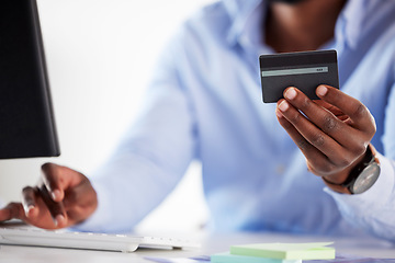 Image showing Hand, black man and typing with credit card, office and online shopping with password, discount and payment. African customer, cyber security and e commerce with desktop, pc and fintech in workplace