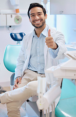 Image showing Dentist, thumbs up and portrait of man in office for teeth whitening, service and dental care. Healthcare, dentistry and orthodontist with thank you hand sign for oral hygiene, wellness or cleaning