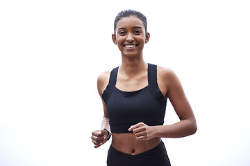 Image showing Portrait of woman, running on sky background and fitness with smile, exercise and clouds on outdoor run. Workout, sports and girl runner with happy face in India with health, wellness and training.