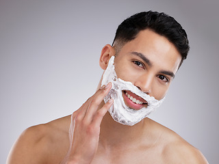 Image showing Happy, shaving and foam with portrait of man in studio for hair removal, grooming and skincare. Cosmetics, self care and morning with face of male model on gray background for cleaning and product