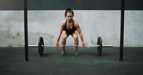 Image showing Weight lifting, fitness and woman with barbell for strong body in gym for training, exercise and workout. Sports, deadlift and female bodybuilder lift weights for challenge, wellness and strength