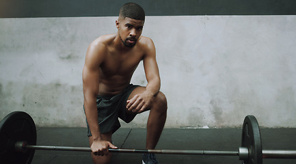 Image showing Weight lifting, fitness or portrait of man with barbell in gym for training, exercise and intense workout. Muscle, strong body and African bodybuilder lift weights for challenge, wellness or strength