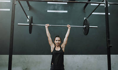 Image showing Weightlifting, fitness and woman with barbell in gym for training, exercise and workout for muscles. Sports, deadlift and female body builder lifting weights for challenge, wellness or strength