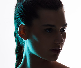 Image showing Beauty, neon and silhouette with face of woman in studio for creative, glow and lighting mockup space. Fantasy, shadow and shine with female model on white background for art, disco or dark aesthetic