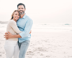 Image showing Beach, love and portrait of couple hug with smile on holiday, vacation and weekend for marriage. Travel, mockup space and happy mature man hugging woman for bonding, quality time and relax by ocean