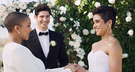 Image showing Happy, holding hands and lgbtq with lesbian couple at wedding for celebration, gay and pride. Smile, love and happiness with women at marriage event for partner commitment, sexuality and freedom