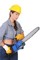 Image showing Beauty woman with chainsaw