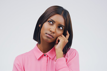 Image showing Confused, thinking and woman in studio with decision on mockup, space and white background. Choice, contemplation and indian female person with doubt, emoji and problem solving of ideas for questions