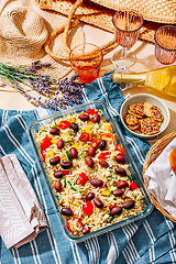 Image showing Picnic time - homemade orzo pasta salad with feta, olives, tomatoes