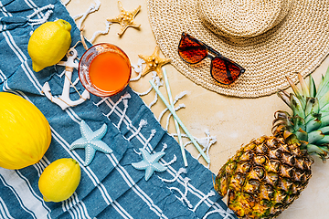 Image showing Summer holiday concept, summer accessories with refreshing juice and fresh fruits