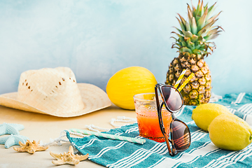 Image showing Summer holiday concept, summer accessories with refreshing juice and fresh fruits