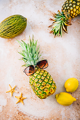 Image showing Summer concept - Pineapple hipster in sunglasses with summer fruits, creative art fashionable vacation concept