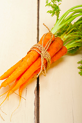 Image showing baby carrots bunch tied with rope