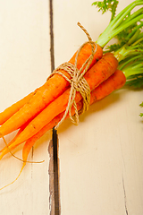 Image showing baby carrots bunch tied with rope