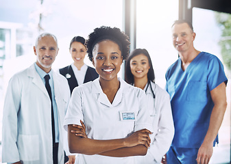 Image showing Smile, team and portrait of black woman with doctors, nurses and diversity in hospital with teamwork in healthcare. Health, support and boss, confident doctor with group of medical employees together