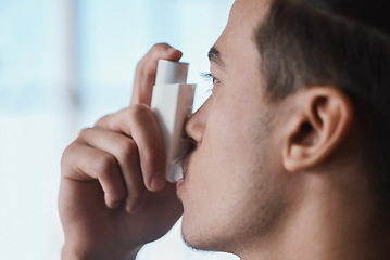 Image showing Asthma pump, breathe and man with healthcare, medicine and wellness spray for health. Breathing, inhaler and lung relief with a male person holding medication for medical problem support and care