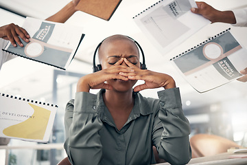 Image showing Anxiety, business and black woman with stress, multitasking and annual report deadline with a headache. Female person, consultant and agent with a migraine, chaos and headphones with documents or crm