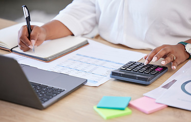 Image showing Budget, accountant with calculator and notebook with laptop calculating finance in a modern office. Financial planning or audit, accounting or expenses and female person working at workspace