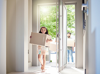 Image showing Happy family, real estate and child moving in new home with box for property, mortgage loan or celebration. Mother, father and little girl homeowner walking and carrying boxes together in the house