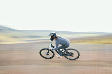 Image showing Adrenaline, blur and athlete riding a motorcycle in nature training for a race, marathon or competition. Sports, motion and male biker practicing for an outdoor fitness cardio exercise or workout.