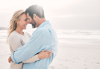 Image showing Beach, love and couple touching forehead on holiday, vacation and weekend for anniversary. Mockup space, marriage and happy mature man hugging woman for bonding, quality time and happiness by ocean