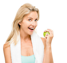 Image showing Portrait, fitness and apple with a senior woman in studio isolated on a white background for health. Exercise, diet and lifestyle with a mature female athlete eating fruit for nutrition or weightloss