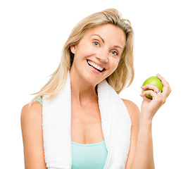 Image showing Portrait, exercise and apple with a senior woman in studio isolated on a white background for health. Fitness, diet and lifestyle with a happy mature female athlete eating a fruit for nutrition