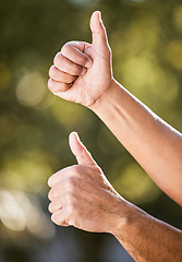 Image showing Thumbs up, hands and partner with team building outdoor for solidarity, agreement or emoji in summer sunshine. Partnership, people and sign for yes, teamwork or motivation in park, garden or backyard