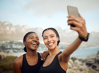 Image showing Fitness friends laugh in selfie at beach, women workout together with happiness and active life outdoor. Exercise in nature, healthy and happy with female people training and smile in picture or post