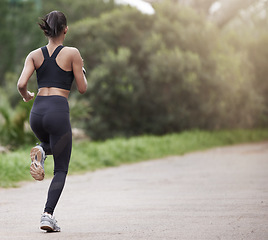 Image showing Running in nature, woman from back and fitness, mockup space and trees on healthy workout on path. Exercise, health and wellness, girl runner on forest path with commitment to training on outdoor run