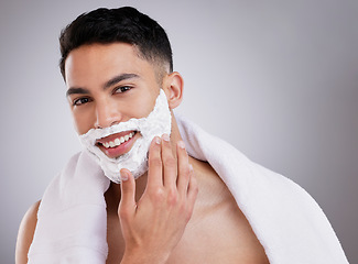 Image showing Beauty, shaving and foam with portrait of man in studio for hair removal, grooming and skincare. Cosmetics, self care and shaver cream with face of model on gray background for cleaning and product