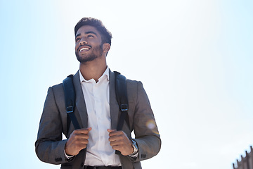 Image showing Business man, backpack and walking in street, city and summer sunshine with smile with vision. Young indian businessman, outdoor and walk with happiness, thinking and professional in metro for travel