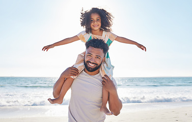 Image showing Father, child and piggyback on the beach for summer vacation or holiday love or family and kid smile on a seaside for quality bonding time. Happy, dad and kid relax on nature or travel adventure