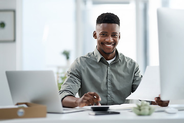 Image showing Black man, portrait and laptop with documents for finance, audit or accounting at the office desk. Happy African male accountant or businessman with smile for financial planning, budget or paperwork