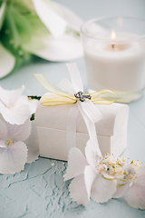 Image showing Confirmation or First holy communion concept  - small present with candle and flowers