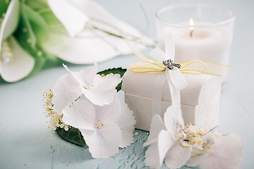 Image showing Confirmation or First holy communion concept  - small present with candle and flowers