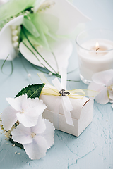 Image showing Confirmation or First holy communion concept  - small present with candle and flowers