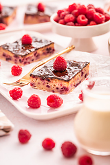 Image showing Traditional buttermilk sheet cake with raspberries and  chocolate ganache