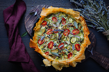 Image showing Delicious vegetarian summer quiche with zucchini, tomato, mushrooms, sage and lavender with phyllo pastry