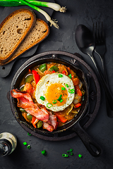 Image showing Letscho - tasty Hungarian vegetable stew with peppers, tomatoes  and onions, served with bacon and fried egg