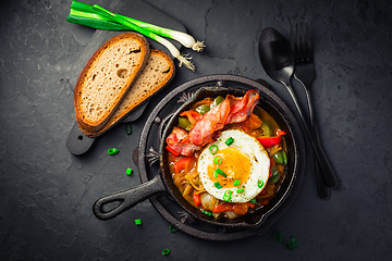 Image showing Letscho - tasty Hungarian vegetable stew with peppers, tomatoes  and onions, served with bacon and fried egg