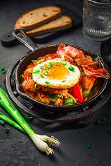 Image showing Letscho - tasty Hungarian vegetable stew with peppers, tomatoes  and onions, served with bacon and fried egg